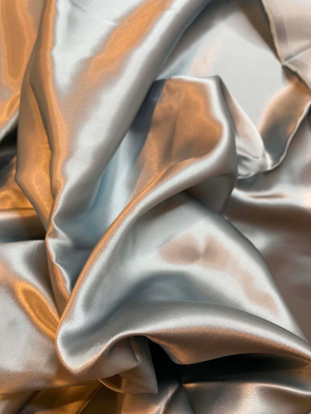 Light silver blue satin.  Sold by the yard.